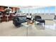 Bright living room features tile floors, modern furniture, and panoramic ocean views at 534 Beach Rd, Sarasota, FL 34242