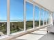 Bright living room features floor to ceiling windows offering gorgeous beach views at 534 Beach Rd, Sarasota, FL 34242