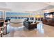 Bright and airy living room with floor-to-ceiling windows offering breathtaking ocean views at 534 Beach Rd, Sarasota, FL 34242