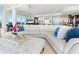 Spacious living room features elegant decor, plush sofa, and views of the outside at 534 Beach Rd, Sarasota, FL 34242