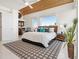 Bright and airy main bedroom with stylish decor, wood ceiling, and large windows at 534 Beach Rd, Sarasota, FL 34242