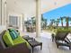 Relaxing outdoor patio featuring comfortable seating, BBQ and lush landscaping, perfect for entertaining and enjoying the outdoors at 534 Beach Rd, Sarasota, FL 34242