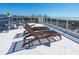 Relaxing rooftop terrace with beach chairs and ocean views, creating a serene and picturesque outdoor living space at 534 Beach Rd, Sarasota, FL 34242