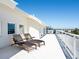 Rooftop deck showcasing lounge chairs with ocean views, perfect for relaxation and enjoying the coastal atmosphere at 534 Beach Rd, Sarasota, FL 34242