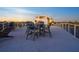 Enjoy outdoor dining on this home's expansive rooftop deck with beautiful city views at 534 Beach Rd, Sarasota, FL 34242