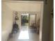 Bright entryway showcasing tile floors and a view of the outdoor space through a sliding door at 540 Palmetto Ne Dr, Port Charlotte, FL 33952