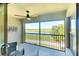 Relaxing screened-in balcony provides serene views of the lake and golf course at 5710 Palmer Cir # 203, Bradenton, FL 34211