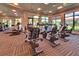 A spacious gym featuring a variety of cardio machines and free weights and large windows for natural light at 5710 Palmer Cir # 203, Bradenton, FL 34211