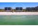 Picture of a beachfront condo with clear blue ocean and bright sky at 575 Sanctuary Dr # A304, Longboat Key, FL 34228