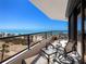 Enjoy the beautiful beach views on this spacious balcony with comfortable seating at 575 Sanctuary Dr # A304, Longboat Key, FL 34228