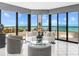 Bright living room featuring floor-to-ceiling windows with stunning ocean views at 575 Sanctuary Dr # A304, Longboat Key, FL 34228