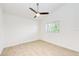 Clean, bright bedroom with wood flooring and a ceiling fan at 612 Ironwood Cir # 170, Venice, FL 34292
