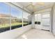 Screened in patio with lots of windows looking out onto the back yard at 612 Ironwood Cir # 170, Venice, FL 34292