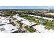 Bird's eye view of property showcasing a serene neighborhood with water access and a community pool at 6902 8Th W Ave, Bradenton, FL 34209