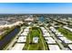 An aerial view that displays the community, highlighting water views, swimming pools and nearby shopping centers at 6902 8Th W Ave, Bradenton, FL 34209