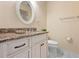 Bathroom featuring granite countertops, a large mirror and custom cabinets at 6902 8Th W Ave, Bradenton, FL 34209