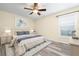 Bedroom featuring wood-look floors, neutral walls and a window overlooking the outside at 6902 8Th W Ave, Bradenton, FL 34209
