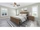 Comfortable bedroom with hardwood floors, neutral walls, a ceiling fan and natural light at 6902 8Th W Ave, Bradenton, FL 34209