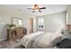 Bright bedroom with modern decor, wood floors, large dresser and natural light at 6902 8Th W Ave, Bradenton, FL 34209