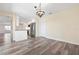 Dining room with hardwood floors, an overhead chandelier, and easy access to the kitchen at 6902 8Th W Ave, Bradenton, FL 34209