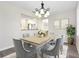 Elegant dining room with stylish chandelier and comfortable seating at 6902 8Th W Ave, Bradenton, FL 34209