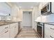 Well-equipped kitchen featuring stainless steel appliances and ample counter space at 6902 8Th W Ave, Bradenton, FL 34209