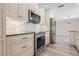 Bright kitchen with stainless steel appliances and white cabinetry at 6902 8Th W Ave, Bradenton, FL 34209