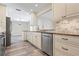 Modern kitchen with stainless steel appliances and granite countertops at 6902 8Th W Ave, Bradenton, FL 34209