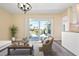 Inviting living room with sliding glass doors, patio view, and stylish decor at 6902 8Th W Ave, Bradenton, FL 34209