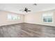 Spacious living room with abundant natural light and wood flooring at 6902 8Th W Ave, Bradenton, FL 34209