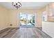 Living room featuring a sliding glass door, patio view, and hardwood floors at 6902 8Th W Ave, Bradenton, FL 34209