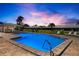 Community pool with chairs and tables, perfect for relaxation and outdoor recreation at 6902 8Th W Ave, Bradenton, FL 34209