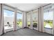 Bright sun room with large windows offering panoramic views of the outdoor patio and garden at 6902 8Th W Ave, Bradenton, FL 34209