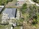 Aerial shot shows a new gray-roofed home next to other houses in a sunny neighborhood at 6970 Beckwith Ave, North Port, FL 34291