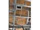 Close up of the underside of a roof, showing framing, duct work, water pipes and electrical wiring at 6970 Beckwith Ave, North Port, FL 34291