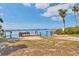 Picturesque community dock with seating provides a relaxing waterfront experience, perfect for enjoying scenic water views at 7337 Starfish Dr, Sarasota, FL 34231