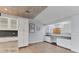 Open space with ample cabinet storage, stone countertop, and integrated work space with natural light at 7337 Starfish Dr, Sarasota, FL 34231