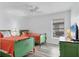 Bedroom with two twin beds, ceiling fan, and television at 7402 8Th W Ave, Bradenton, FL 34209