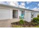 Close up of exterior with gated entrance and a well-maintained landscaped garden area at 7402 8Th W Ave, Bradenton, FL 34209