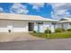 Charming single-story villa with tile roof, white exterior and a well-maintained lawn at 7402 8Th W Ave, Bradenton, FL 34209