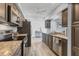 Well-lit kitchen featuring stainless steel appliances and granite countertops at 7402 8Th W Ave, Bradenton, FL 34209