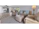 Bright and airy living room offering ample seating and a seamless connection to the outdoors at 7402 8Th W Ave, Bradenton, FL 34209