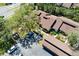Aerial view showcasing the community's well-maintained roofs, parking, landscaping, and proximity to local amenities at 7523 4Th W Ave # 7523, Bradenton, FL 34209