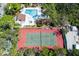 Aerial view of the community pool, spa, and tennis courts surrounded by lush greenery offering resort-style living at 7523 4Th W Ave # 7523, Bradenton, FL 34209