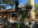 Back exterior view featuring seating area, plants and brown wood at 7523 4Th W Ave # 7523, Bradenton, FL 34209