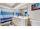 Bright bathroom with a double vanity, large mirror, and tiled shower/tub combo at 7523 4Th W Ave # 7523, Bradenton, FL 34209