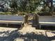 Boardwalk with benches overlooking the water and a waterfront community at 7523 4Th W Ave # 7523, Bradenton, FL 34209
