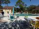 Relax by the community pool with ample seating and shaded areas, ideal for leisure and socializing at 7523 4Th W Ave # 7523, Bradenton, FL 34209