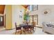 Bright dining room with high ceilings, a chandelier, and large windows at 7523 4Th W Ave # 7523, Bradenton, FL 34209