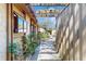 Charming walkway leading to the home's entrance with mature landscaping at 7523 4Th W Ave # 7523, Bradenton, FL 34209
